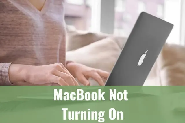 Woman typing to her laptop