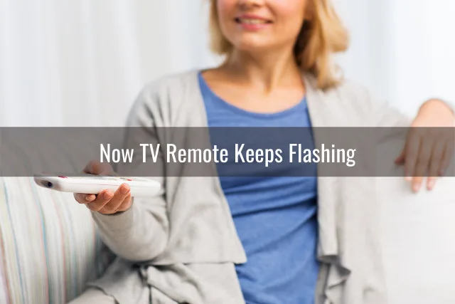 Woman holding a remote while watching tv