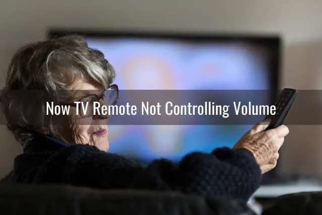 Confused woman while holding a remote