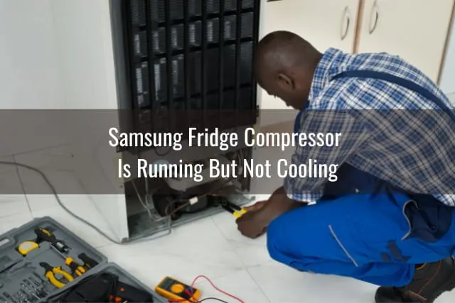 Man fixing the back of the fridge