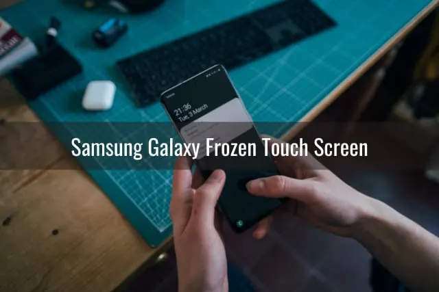 Black samsung while holding