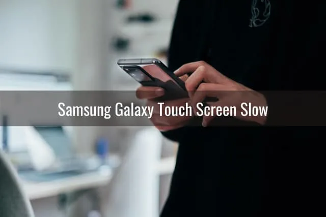 Black samsung while holding