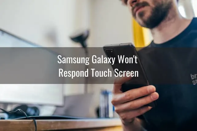 Black samsung while holding