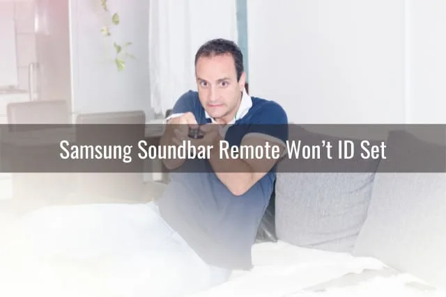 Frustrated man holding a remote