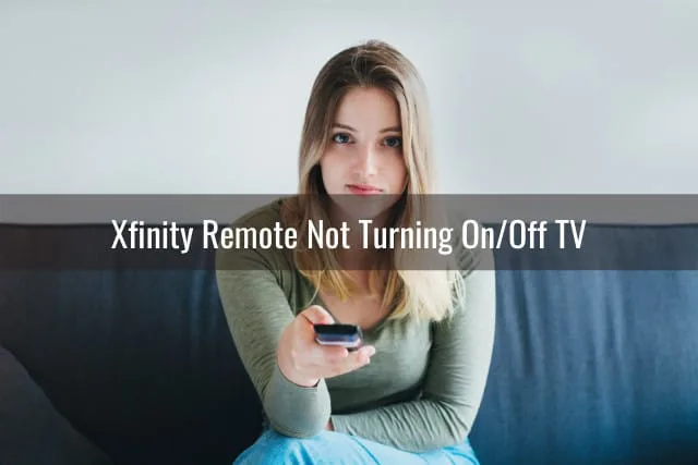 Woman holding a remote while watching tv