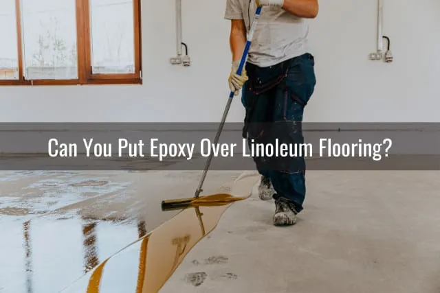 Man putting epoxy on the floor