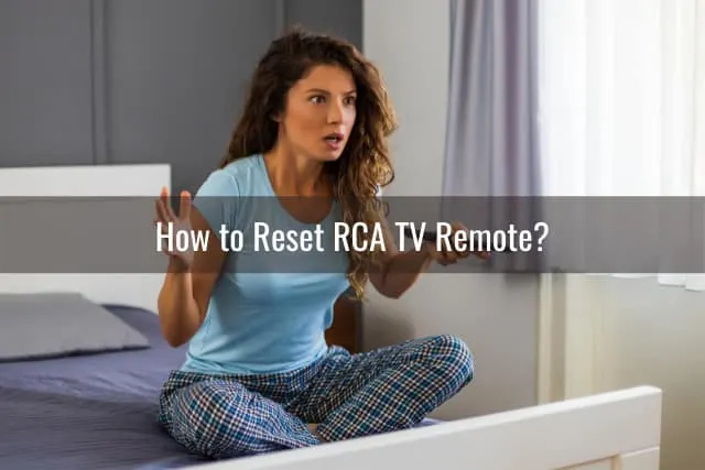Confused woman holding a remote