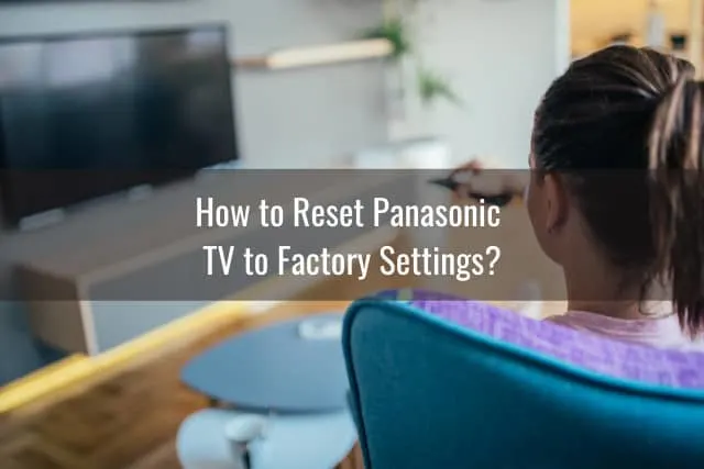 Woman holding a remote while watching tv
