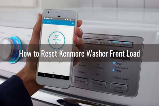 holding a phone behind the washer