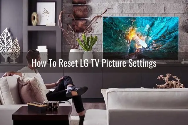 Man watching tv while laying in the sofa