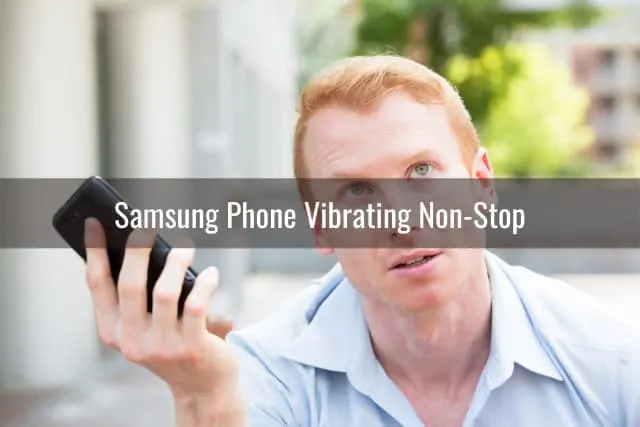 Confused man holding a phone