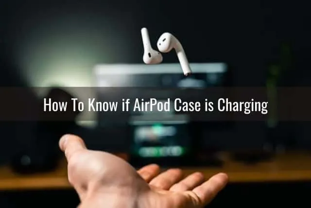 Hand tossing up AirPod headphones