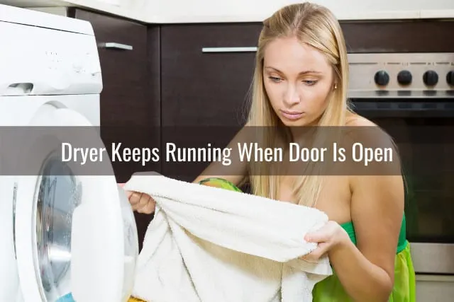 Woman checking the clothes out in the dryer