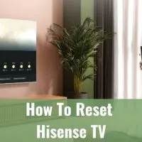 Man standing in front of wall mounted TV
