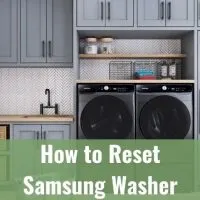 Silver front load washer dryer machines in mud room
