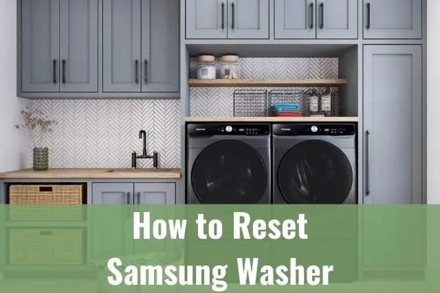 Silver front load washer dryer machines in mud room