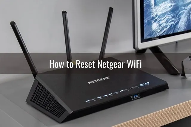 Black WiFi router with 3 antennas