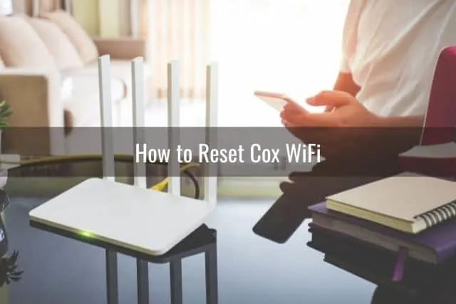 Guy trying to connect phone to WiFi router