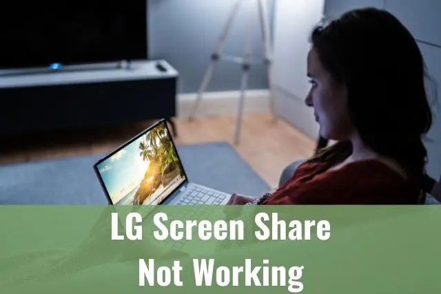Woman on sofa trying to screen share laptop to TV