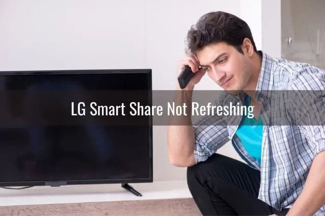Man fixing the flatscreen tv