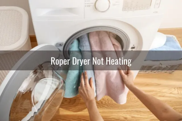 putting clothes inside the dryer