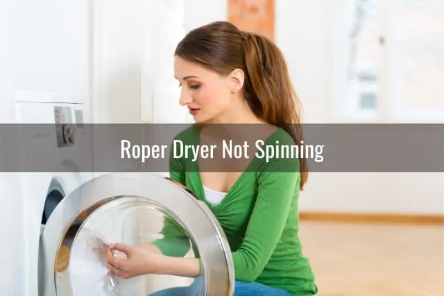 Confused woman while behind the dryer