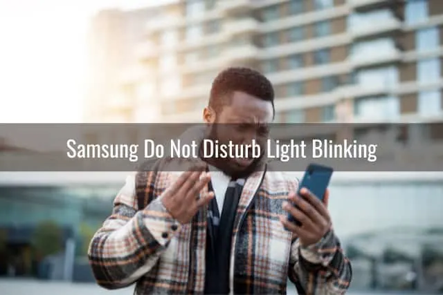 frustrated man while holding a phone