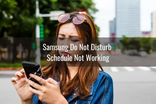 Confused woman holding a phone