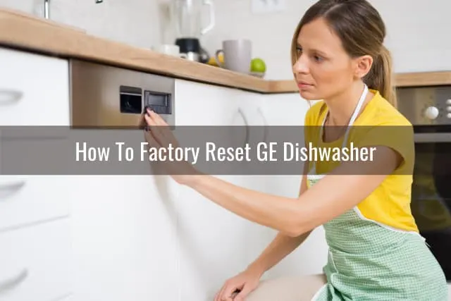Woman checking the button of the dishwasher
