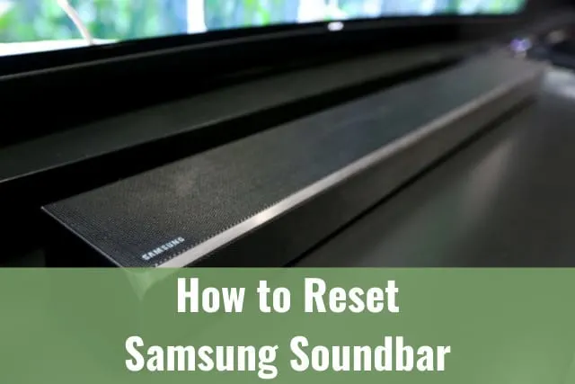 Black Soundbar below the flatscreen 