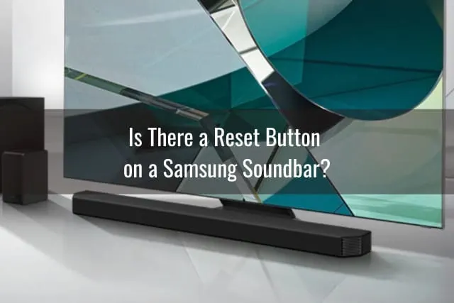 Black Soundbar below the flatscreen