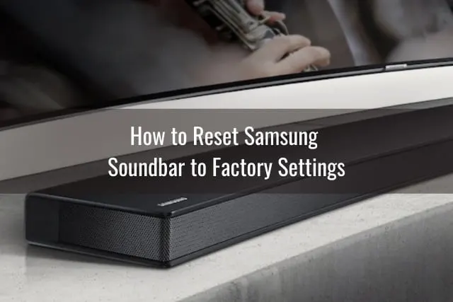 Black Soundbar below the flatscreen
