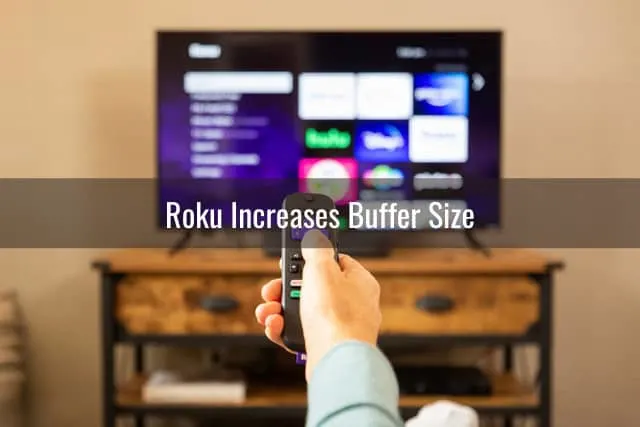 Holding a remote while pointing in the TV