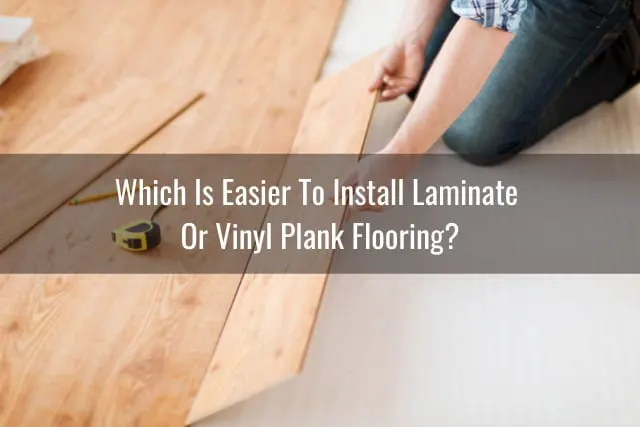 Man putting vinyl tile on the floor