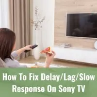Woman holding a remote while pointing in the TV