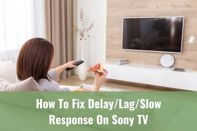 Woman holding a remote while pointing in the TV