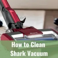 Woman cleaning the floor using vacuum