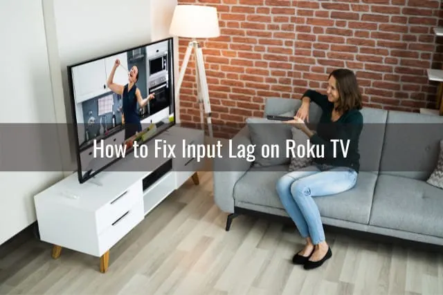 Woman holding a remote while watching tv