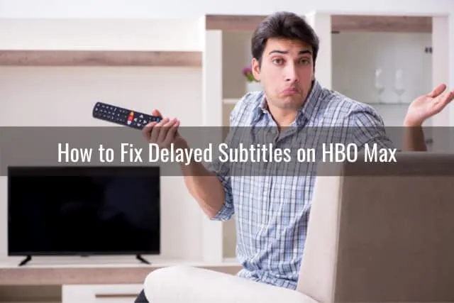 confused man holding a remote while watching tv