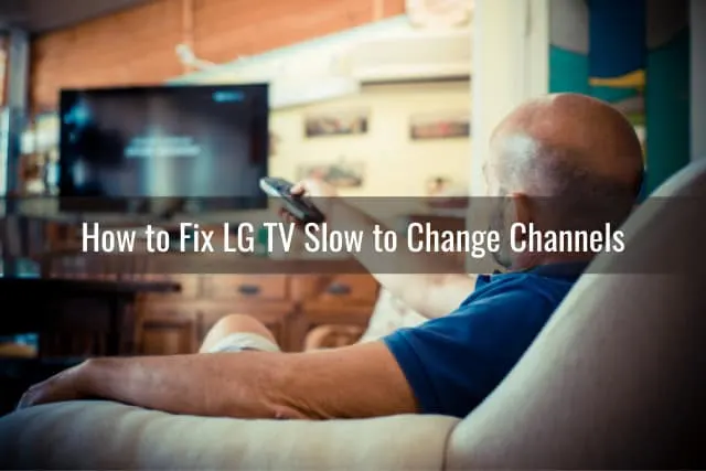 Man holding a remote while pointing in the TV