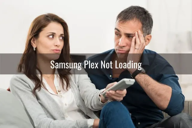 couple holding a remote