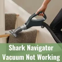 Woman cleaning the carpet using vacuum