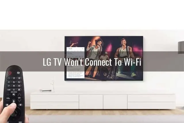 Remote held next to TV