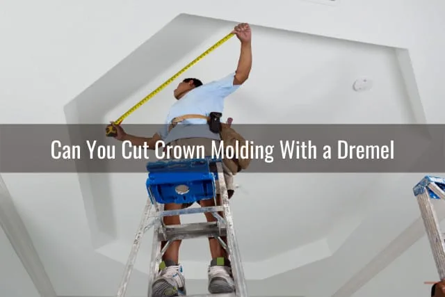 Man cutting the crown molding