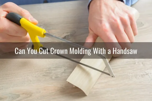 Man cutting the crown molding
