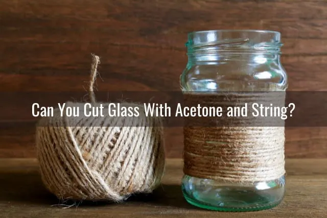 Man cutting the glass using string