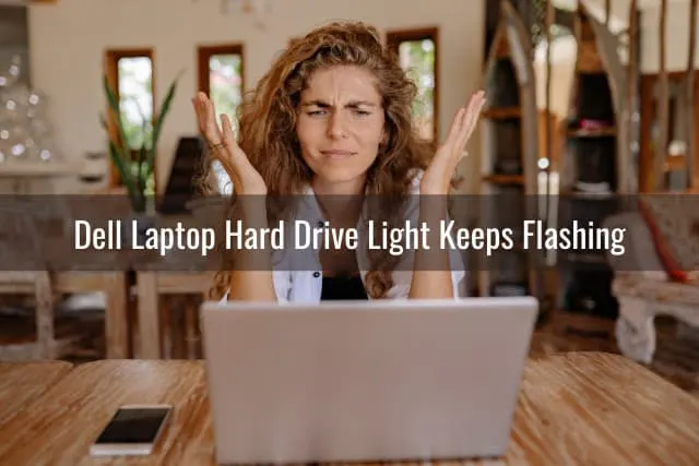 Frustrated woman looking at her laptop