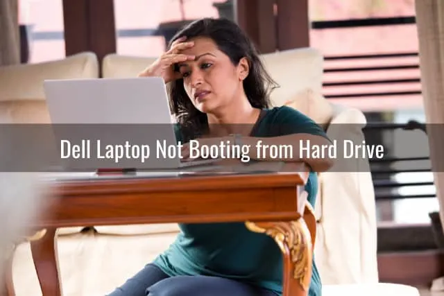 Frustrated woman looking at her laptop