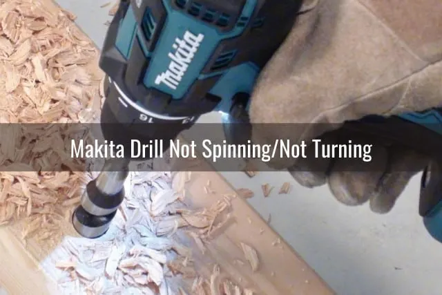 Man using drill in the wood