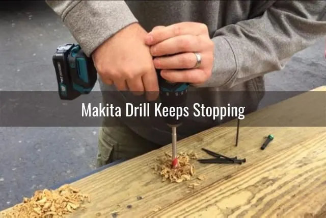 Man using drill in the wood